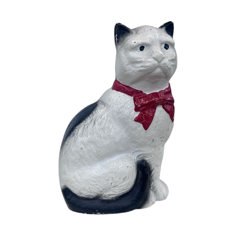 Retro cast iron cat with red bow penny bank by John Wright